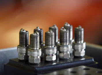 How often should the spark plug be changed, and what are the effects of not changing it for 3 years?